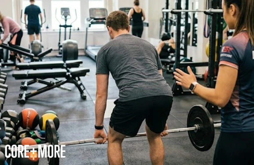 Personal Trainer Balham helping a client improve strength and fitness in a modern gym